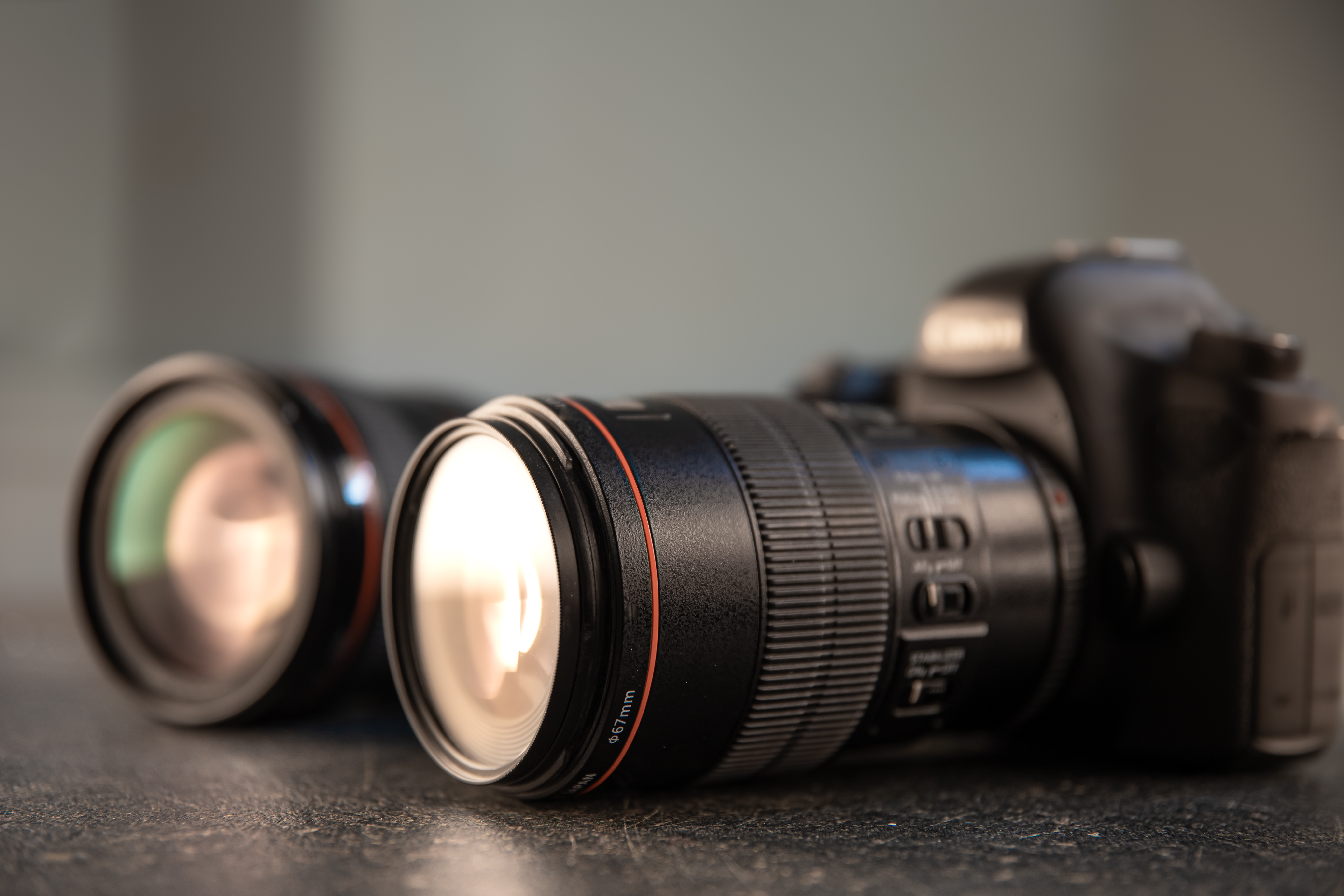Close-up of a camera lens in focus on a professional digital camera